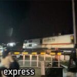Kerala express crossing a rail road crossing in Palakkad Mankara